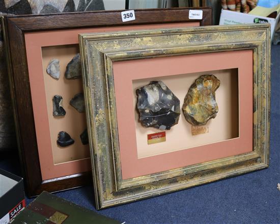 A framed display containing a Paleolithic Henley Pit chopper core and Moortown Pit handaxe and two other displays,